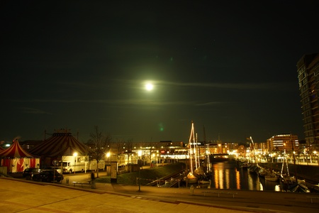 Kiel illuminated skyline at dawn with harbour and glowing skyの写真素材
