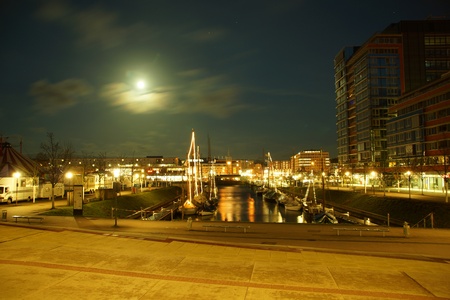 Kiel illuminated skyline at dawn with harbour and glowing skyの写真素材