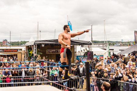 Kiel, Germany - June 24, 2018:  Maximum Wrestling performs outside in the Radio Bob! Rock Camp during the Kieler Woche 2018 - 4th Fight with Title Holder Michael Schenkenbergのeditorial素材