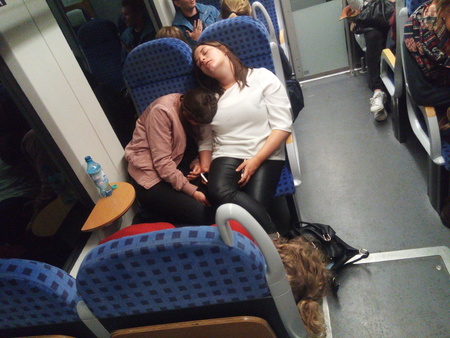 Gettorf, Germany - June 21, 2018: Three women sleep in a full train after Kiel Week 2018のeditorial素材
