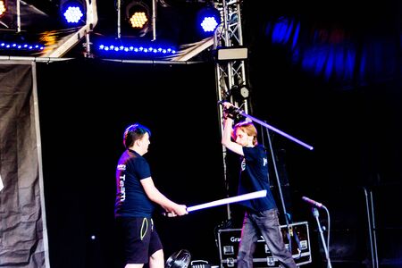 Kiel, Germany - June 22nd 2019: FÃ¶rdesabers are showing a light saber sword fight in the Junge BÃ¼hne during Kiel Week 2019のeditorial素材