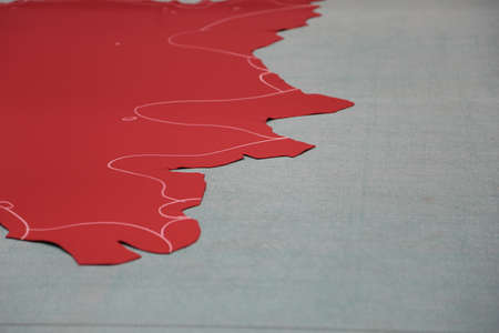 Red leather with chalk lines on gray surfaceの写真素材