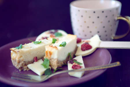 Cheese cake dessert with chocolate lollipop and coffee cupの写真素材
