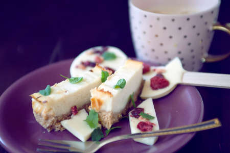 Cheese cake dessert with chocolate lollipop and coffee cupの写真素材