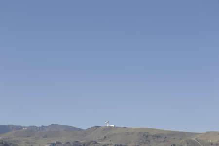 Radio telescope on a Sierra Nevada mountain ridgeの写真素材