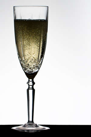 Champagne fizzing in campagne glassの写真素材
