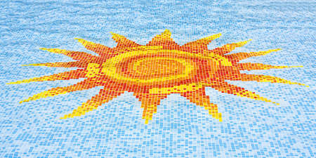 Mosaic of a sun against a blue sky in the floor of a swimming pool