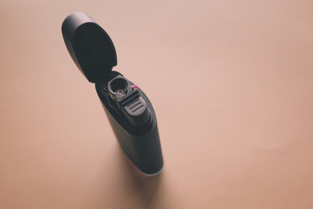 Close-up of an electric hair clipper on a beige backgroundの写真素材