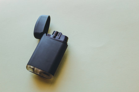 black lighter on a white background. top view, flat lay.の写真素材