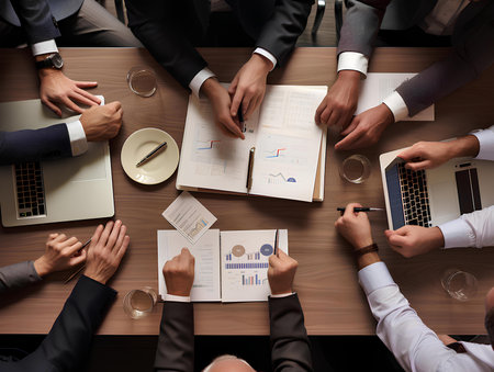 Top view of business people sitting at table and working together in office Ai Generateの素材