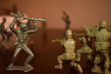 A Close up Shot of Toy Army Men Fighting Each Other.の写真素材