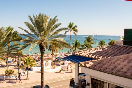 A View of a Crowded Beach Over a Roofの写真素材