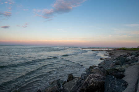 A Beautiful View of the Ocean and Sky at the North Wildwood Sea Wall in New Jerseyの写真素材