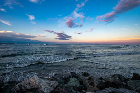 A Beautiful View of the Ocean and Sky at the North Wildwood Sea Wall in New Jerseyの写真素材