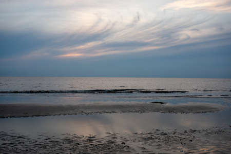 A Whispy Sunset Sky Over the Ocean at the Bay in The Villas, New Jerseyの写真素材
