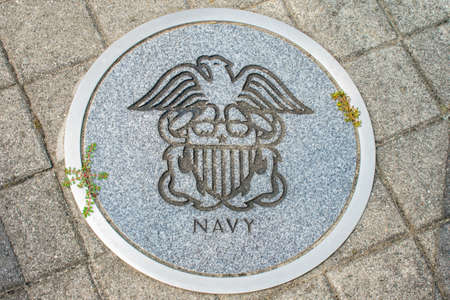WILDWOOD, NEW JERSEY - September 16, 2020: A Circular Symbol Representing The US Navy on the Ground.のeditorial素材