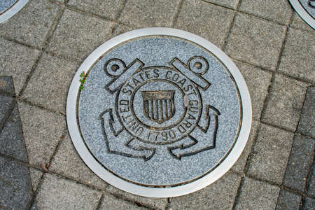 WILDWOOD, NEW JERSEY - September 16, 2020: A Circular Symbol Representing The US Coast Guard on the Ground.のeditorial素材