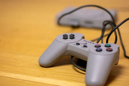 The controller for a Playstation Classic, a recreation model of the originall Playstation, on a...