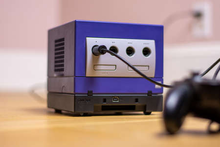 An Indigo Original Gamecube Console, a Popular Retro Console on a wood floor.