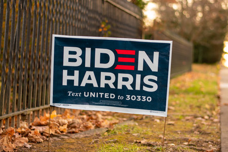 December 5, 2020 - Elkins Park, Pennsylvania: A Biden Harris Campaign Sign on a Suburban Street Next to a Black Metal Fenceのeditorial素材