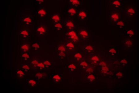 Orange Umbrella Shaped Bokeh on Blackの写真素材