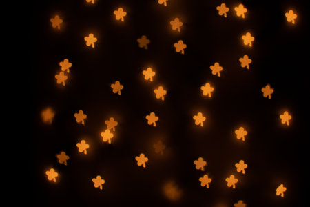 Yellow Clover Shaped Bokeh on Blackの写真素材