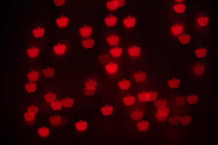 Orange Apple Shaped Bokeh on Blackの写真素材