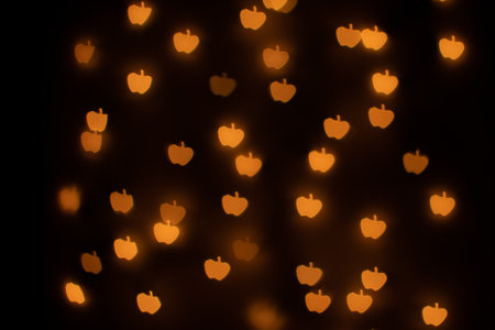 Yellow Apple Shaped Bokeh on Blackの写真素材