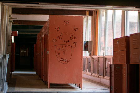 A Locker Room With Red Lockers in an Abandoned Schoolの写真素材