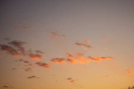 An Orange and Blue Sky With Orange Clouds at Sunsetの写真素材