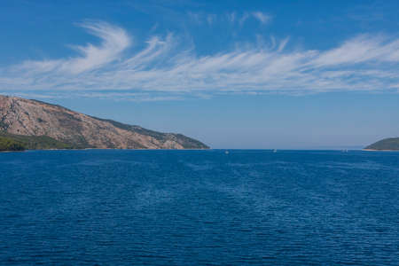Exit from the port of Stari Grad to the open sea. Blue skyの写真素材