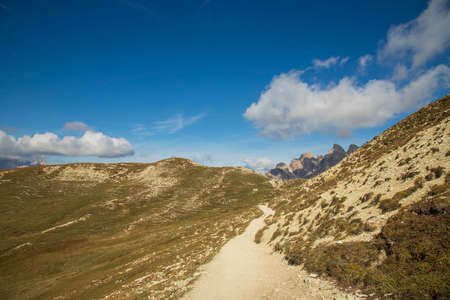 Beautiful landscape with blue sky. Road in the Italian Dolomites around Tre Cime when the sun shinesの写真素材