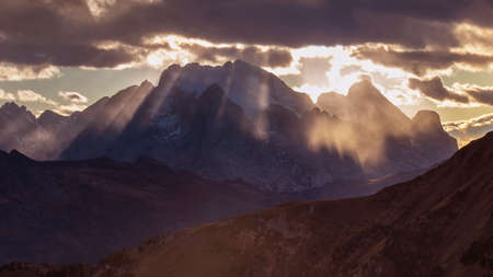 Autumn view of the Passo Giau valley in the Italian Dolomites and the snow-capped Marmolada glacierの写真素材