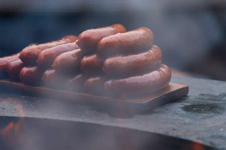 Delicious sausages on the grill for sale.の写真素材