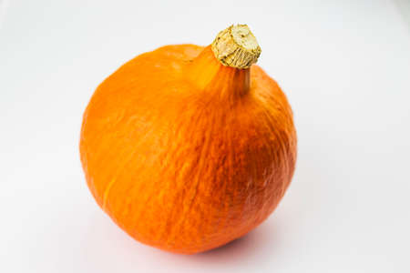 Orange Hokaido pumpkin on white background.の写真素材