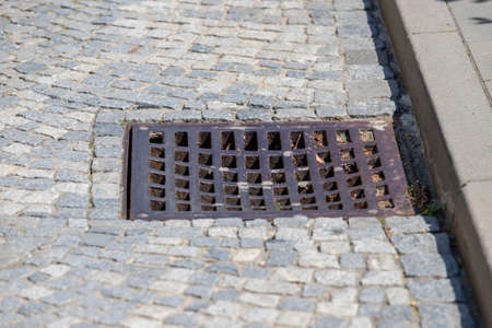 Channel for rainwater drainage into the sewer. The channel is inserted into the path of paving...