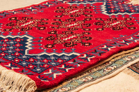 Beautiful red carpet with a pattern in a market in Tunisia.