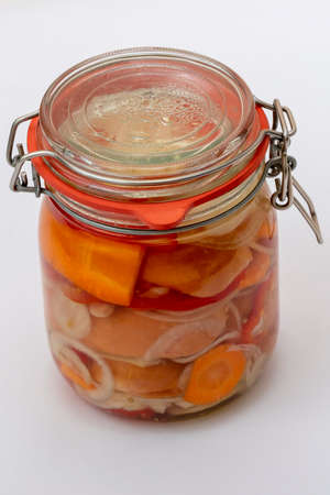 Sausage - marinated in sour sauce with vegetables in a closed glass. Drowned - Czech specialty.の写真素材