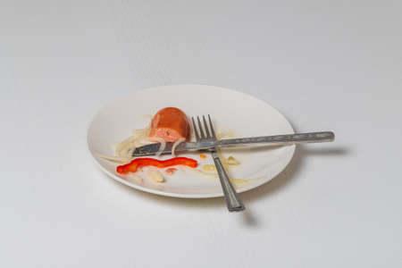 Sausage - marinated in sour pickle with vegetables served with bread. Drowned - Czech specialty. The food is on a white plate on a white table.の写真素材