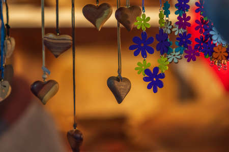 Ornaments and symbols of Christmas hanging on a market stall.