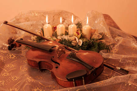 Still life of violin and candlestick as a wish for Christmasの写真素材