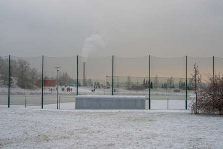 Brno Czech Republic February 10 2021 - a park in a housing estate in the Novy Liskovec district - people play sports on a snowy meadow.のeditorial素材