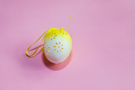 Easter egg as decoration. Decorated Easter eggs on the Easter table. The background is bright.
