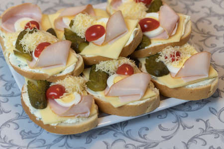 Czech sandwich lying on a white plate on a light table.の写真素材