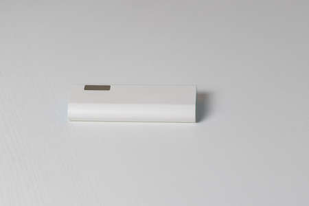 White power bank box on white table.