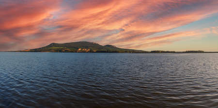 Lake Musov - South Moravia - Czech Republic. Calm water at sunset. Beautiful clouds in the sky.の写真素材