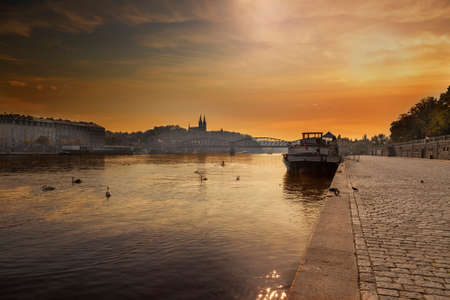 River Vltava with bridges and a boat on the surface in the city of Prague in the Czech Republicの写真素材