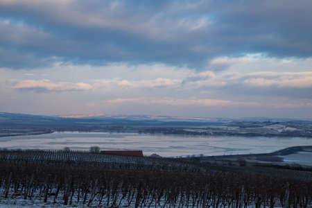 Winter landscape. View of the frozen lake Musov. In the background are the hills of Palava.の写真素材