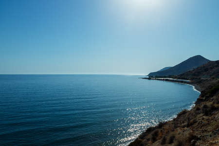 Summer landscape of Crete island in Greece in Europe. Coast in the Larapetra region. In the background is a sunny sky with clouds.の写真素材