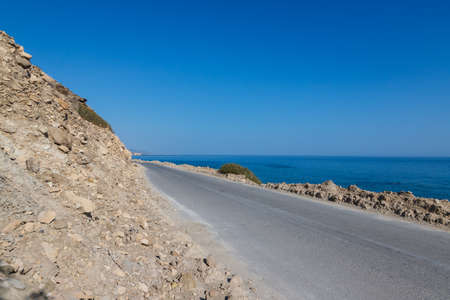 Summer landscape of Crete island in Greece in Europe. Coast in the Larapetra region. In the background is a sunny sky with clouds.の写真素材